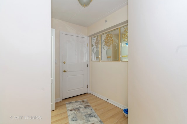 doorway with light wood-type flooring