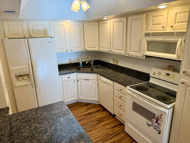 kitchen with white appliances, white cabinets, sink, dark hardwood / wood-style floors, and ceiling fan