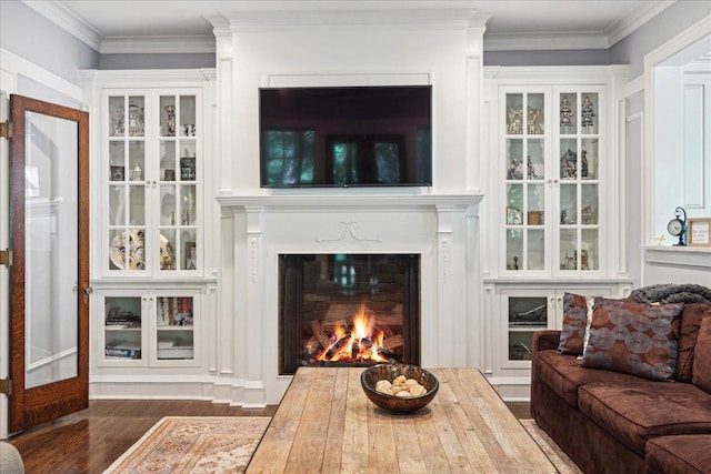 living room featuring ornamental molding and dark wood-type flooring