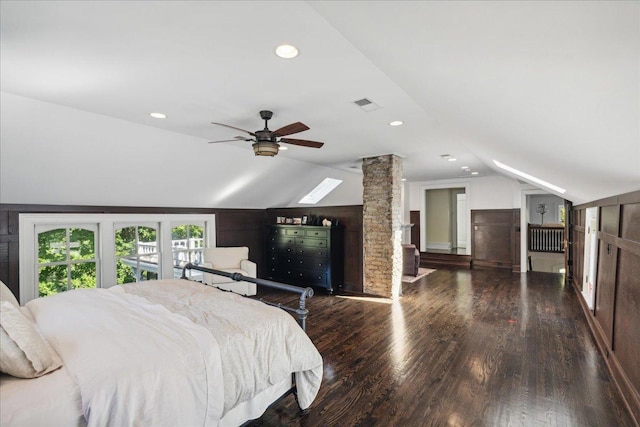 bedroom featuring wood-type flooring, vaulted ceiling, ceiling fan, and ornate columns