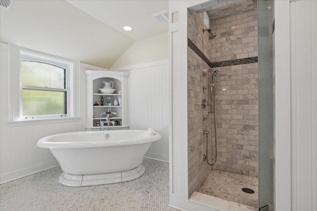 bathroom featuring tile patterned floors, independent shower and bath, and vaulted ceiling