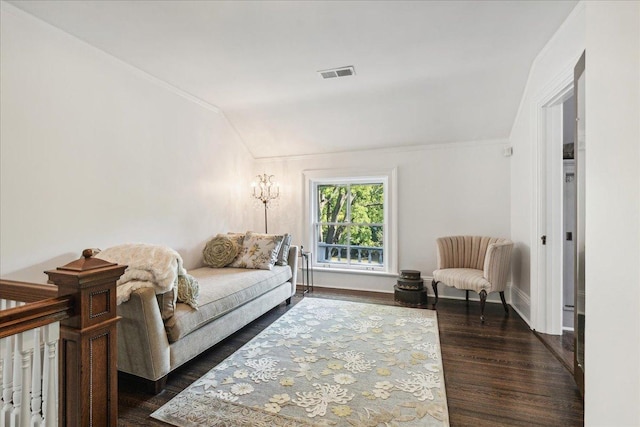 living room featuring dark hardwood / wood-style floors and vaulted ceiling