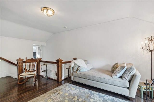 interior space featuring hardwood / wood-style floors and vaulted ceiling