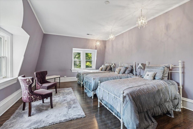 bedroom with dark hardwood / wood-style flooring, crown molding, and an inviting chandelier