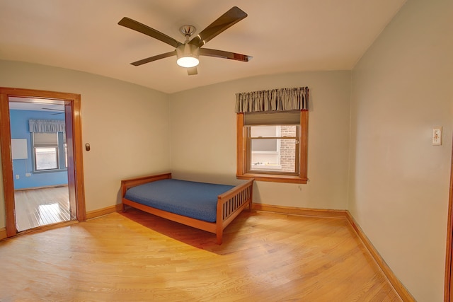 unfurnished bedroom featuring light hardwood / wood-style floors and ceiling fan