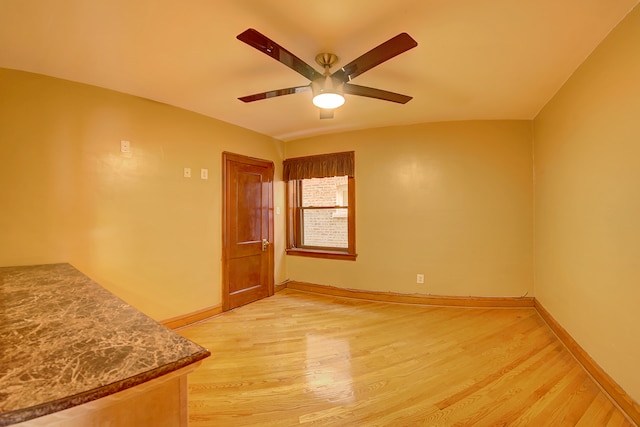 unfurnished room featuring ceiling fan and light hardwood / wood-style flooring