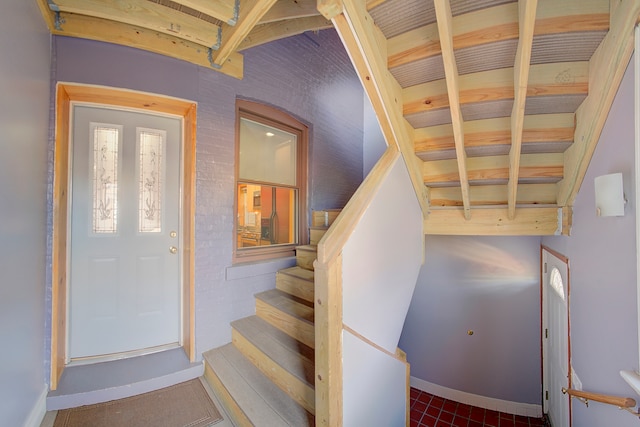 stairs with tile patterned floors