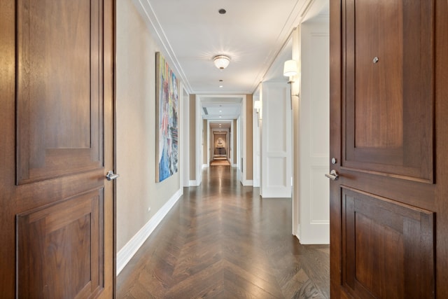 hall featuring dark parquet floors and ornamental molding