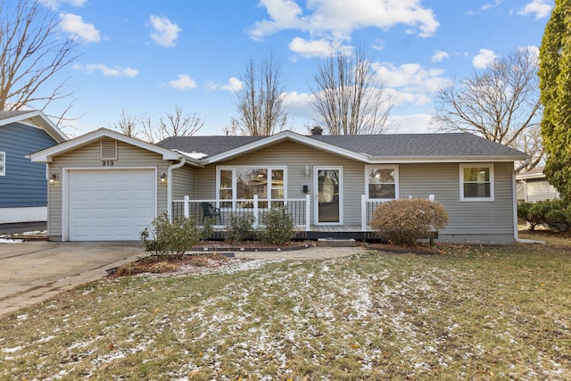 single story home featuring a porch, a garage, and a front yard