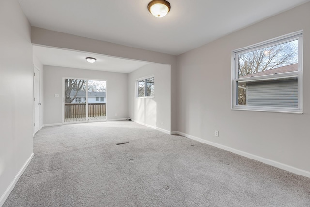 carpeted spare room with plenty of natural light