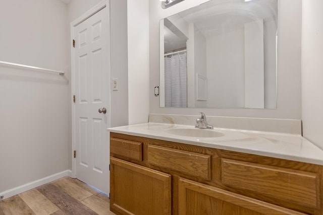 bathroom featuring vanity and hardwood / wood-style flooring