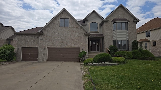 18502 River Rd, Hazel Crest, IL 60429 - view of front of home featuring driveway, a garage, a front yard, and brick siding