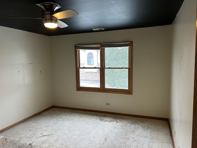 18502 River Rd, Hazel Crest, IL 60429 - unfurnished room with carpet floors, a ceiling fan, and baseboards