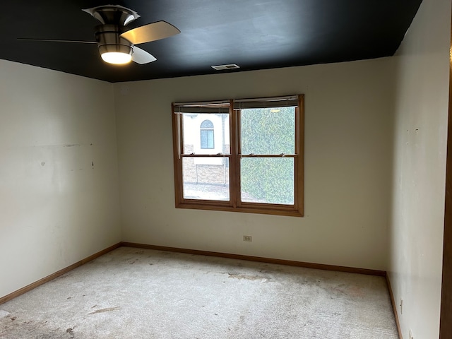 carpeted empty room with ceiling fan