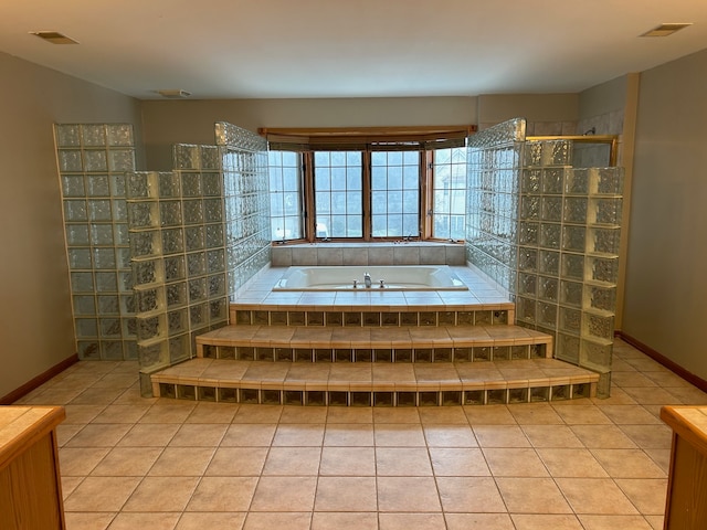 bathroom with tile patterned floors, vanity, and independent shower and bath