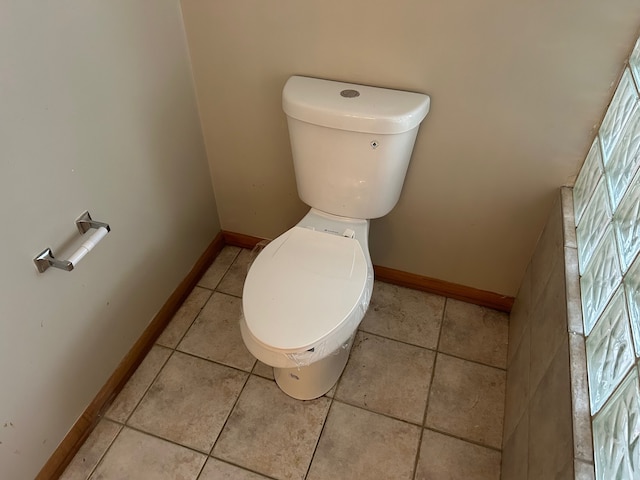 bathroom featuring tile patterned flooring and toilet