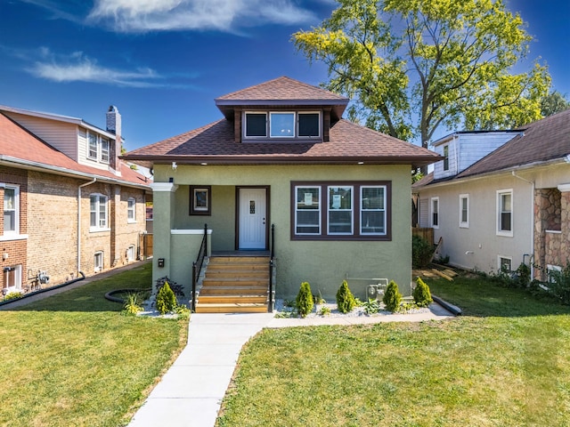 bungalow-style home with a front lawn