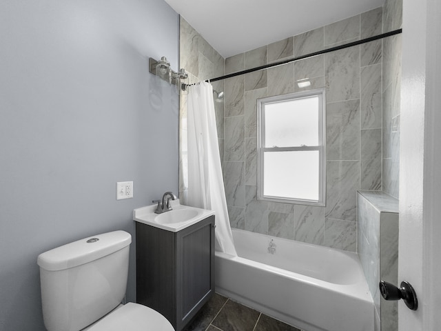 full bathroom featuring tile patterned flooring, shower / bath combination with curtain, vanity, and toilet