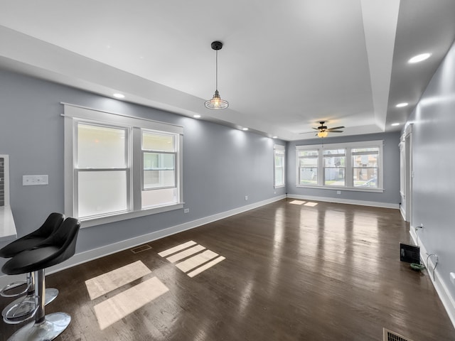 interior space with dark hardwood / wood-style floors and ceiling fan