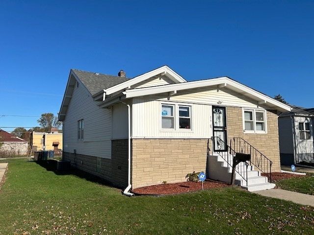 bungalow-style home featuring a front yard