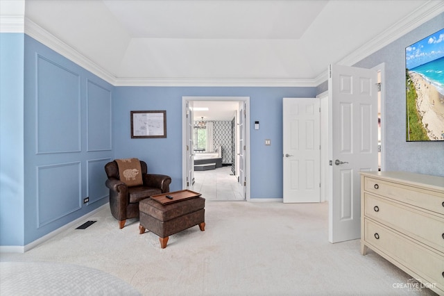 living area featuring light carpet, a tray ceiling, and crown molding