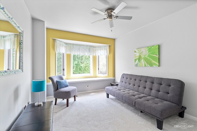 sitting room with carpet and ceiling fan