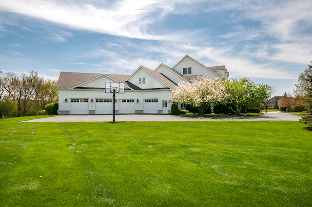 view of front of property with a garage and a front yard