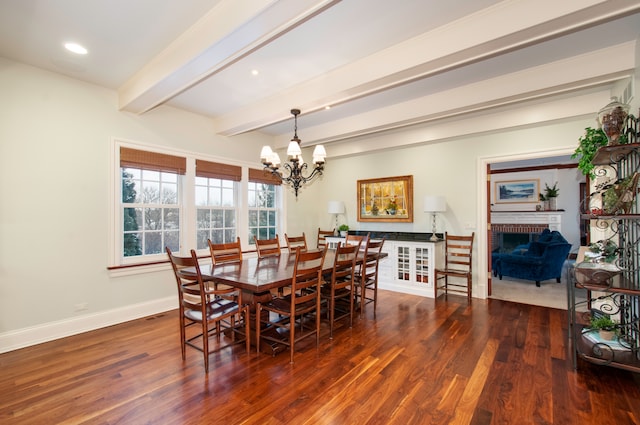 dining room with beam ceiling, a fireplace, dark hardwood / wood-style flooring, and a notable chandelier