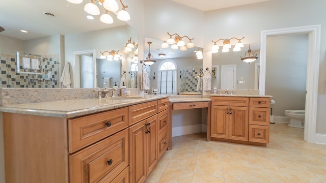 bathroom with vanity, tile patterned flooring, and toilet