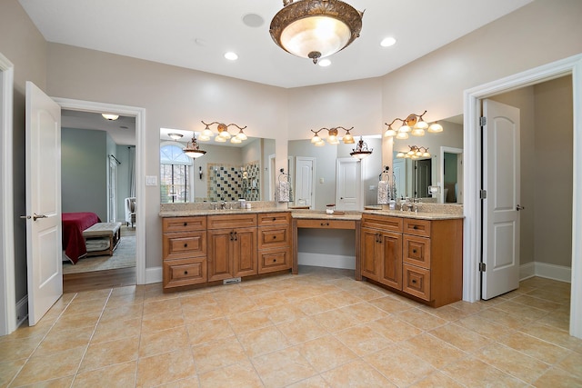 bathroom with vanity, tile patterned floors, and walk in shower