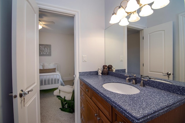 bathroom featuring vanity and a chandelier