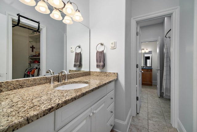 bathroom with tile patterned flooring and vanity