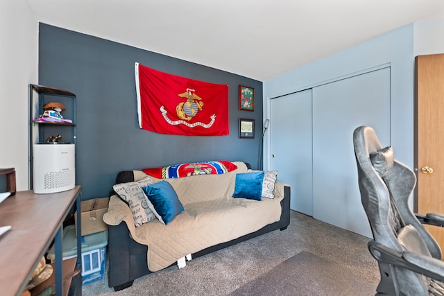 bedroom with carpet and a closet