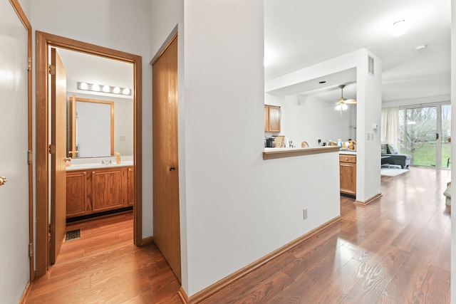 hallway featuring light hardwood / wood-style flooring