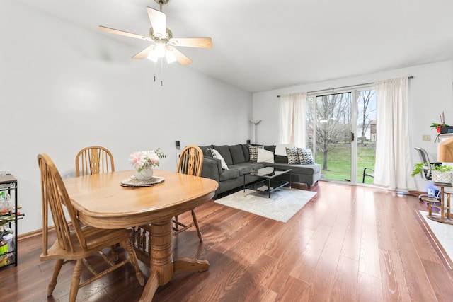 dining area featuring hardwood / wood-style floors, ceiling fan, and lofted ceiling