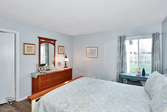 bedroom with hardwood / wood-style floors