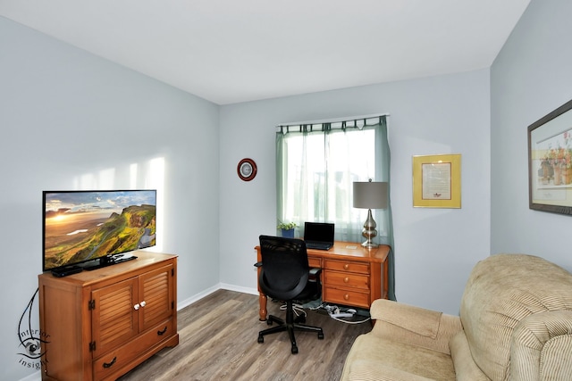 office area with light hardwood / wood-style floors