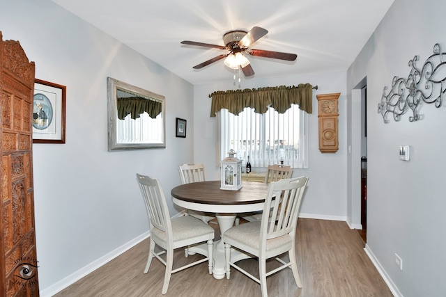 dining space featuring ceiling fan and light hardwood / wood-style floors