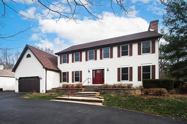 colonial home with a garage