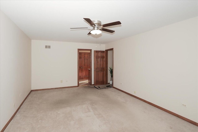 carpeted empty room with ceiling fan