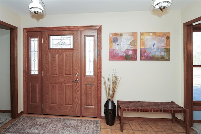 tiled entryway featuring a healthy amount of sunlight