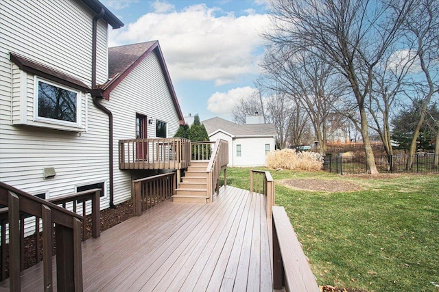 wooden terrace featuring a yard