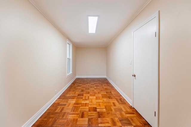 corridor featuring light parquet flooring and ornamental molding