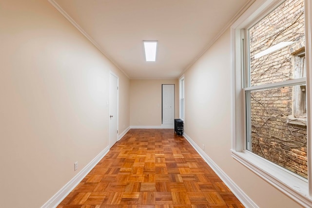 hall featuring light parquet flooring and ornamental molding