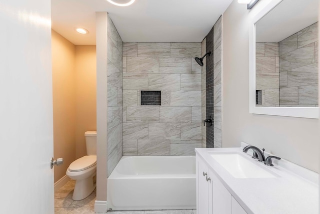 full bathroom with tile patterned floors, vanity, toilet, and tiled shower / bath