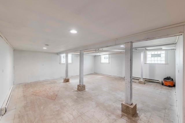 basement featuring a baseboard radiator