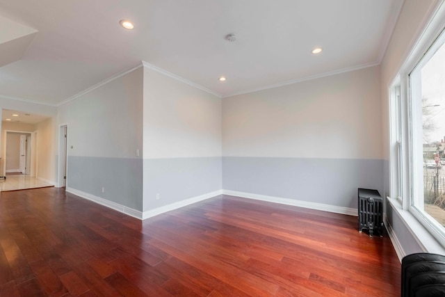 unfurnished room with dark hardwood / wood-style flooring and ornamental molding