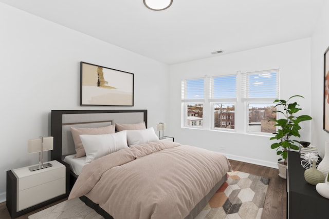 bedroom featuring dark hardwood / wood-style floors