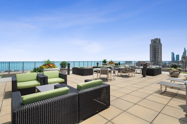 view of patio / terrace featuring a water view and an outdoor hangout area