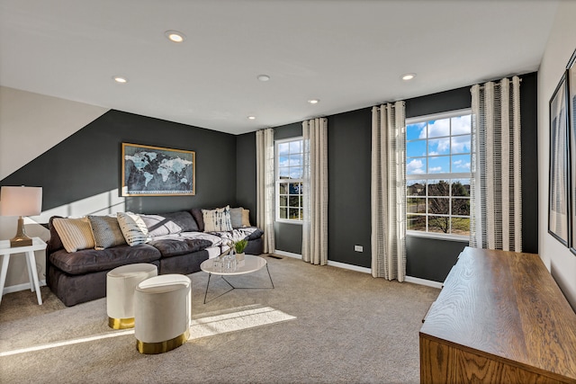 living room with light carpet and plenty of natural light